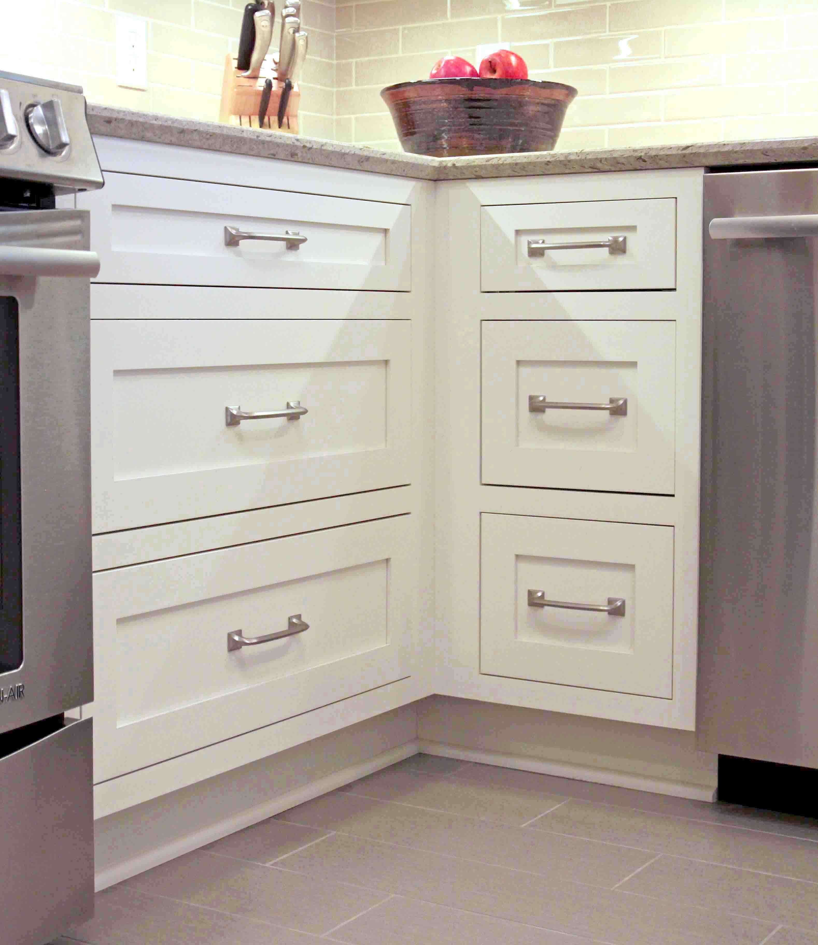 A voided corner in a kitchen design with drawers on each side.