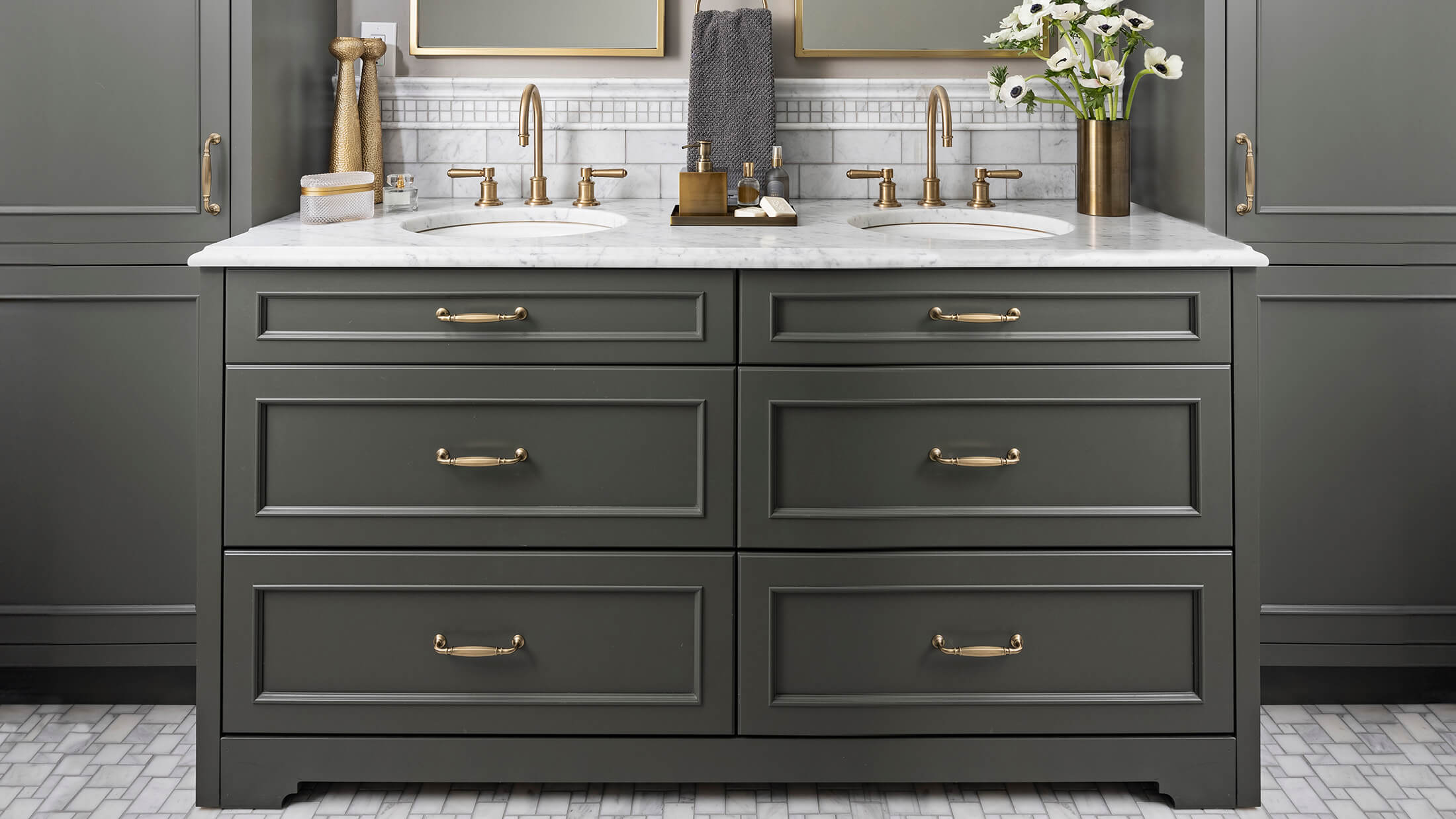 A trendy dark green bathroom vanity.