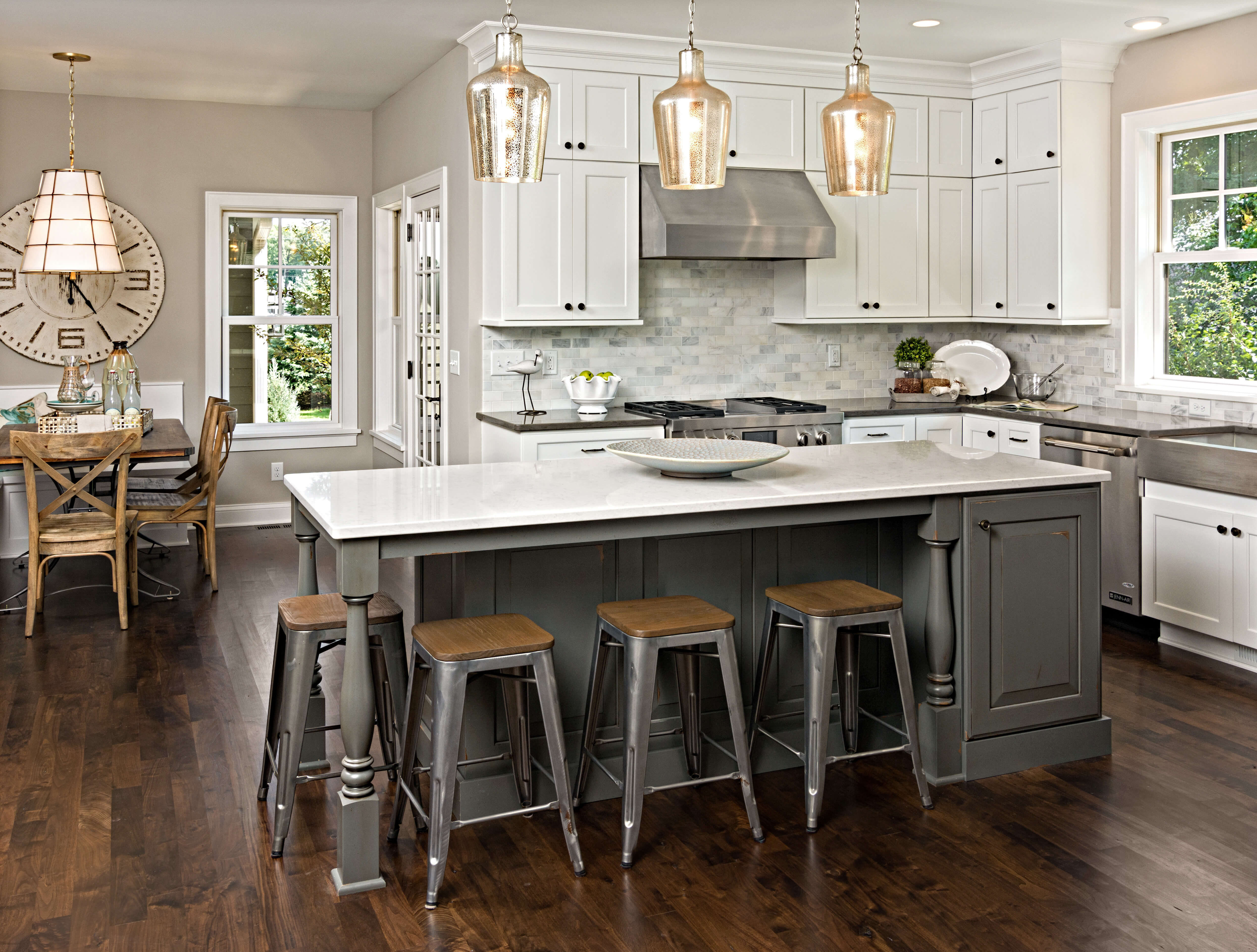 Dura Supreme Cabinetry kitchen featuring a kitchen island with a Heritage Paint finish. Kitchen design by Kristen Peck of Knight Construction Design, Inc., Minnesota.