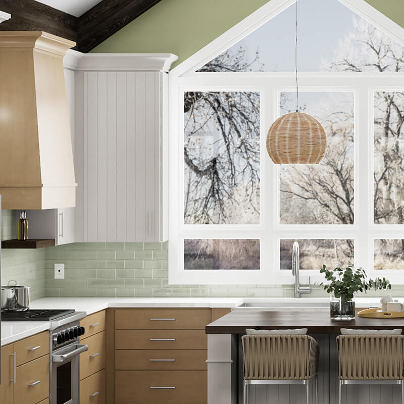 This Scandinavian-inspired kitchen located in the heart of Minnesota is full of delightful design details like an X kitchen island end cap, a tapered modern wood hood, and shiplap-like cabinet doors to name a few. The cabinetry in this kitchen features Dura Supreme’s Linea door style in Pearl paint combined with the Camden door style in a Cashew stain on Maple. The open floating shelves use Dura Supreme’s Caraway stain on Cherry.