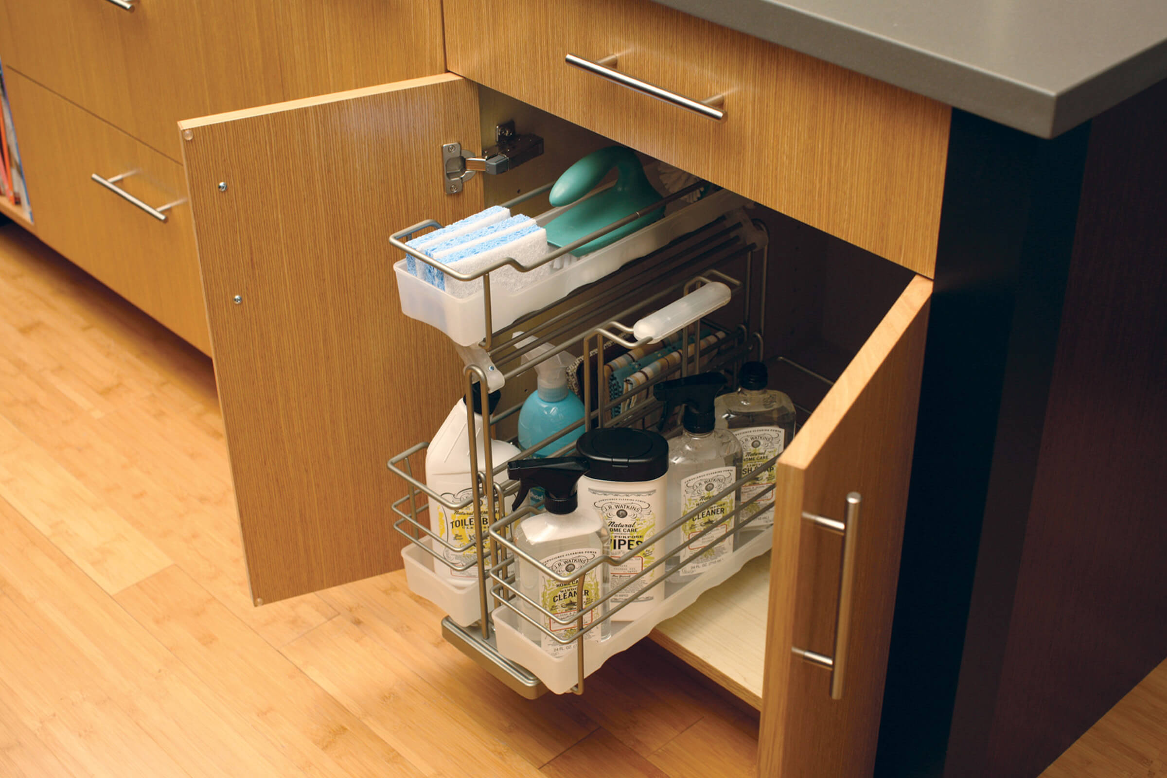 Organize cleaning supplies in our convenient pull-out caddy with detachable, portable basket (SBPOC) from Dura Supreme Cabinetry.
