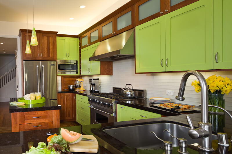 Dura Supreme cherry cabinetry with accent doors of custom green paint. Design by Barbra Bright of Barbra Bright Design, California.