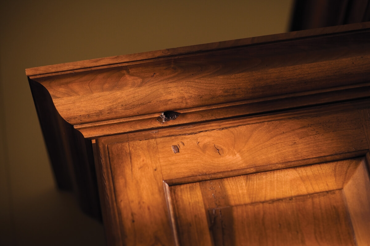 A close look at a crown molding stack at the top of traditional style kitchen cabinets from Dura Supreme.