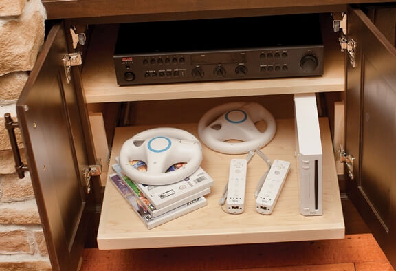 A Flat Roll-Out Shelf is an ideal system for gaming equipment.