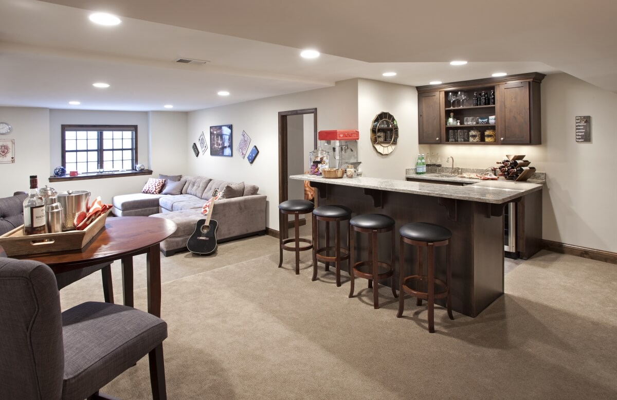 The remodeled finished basement featuring a Dura Supreme Cabinetry wet bar.