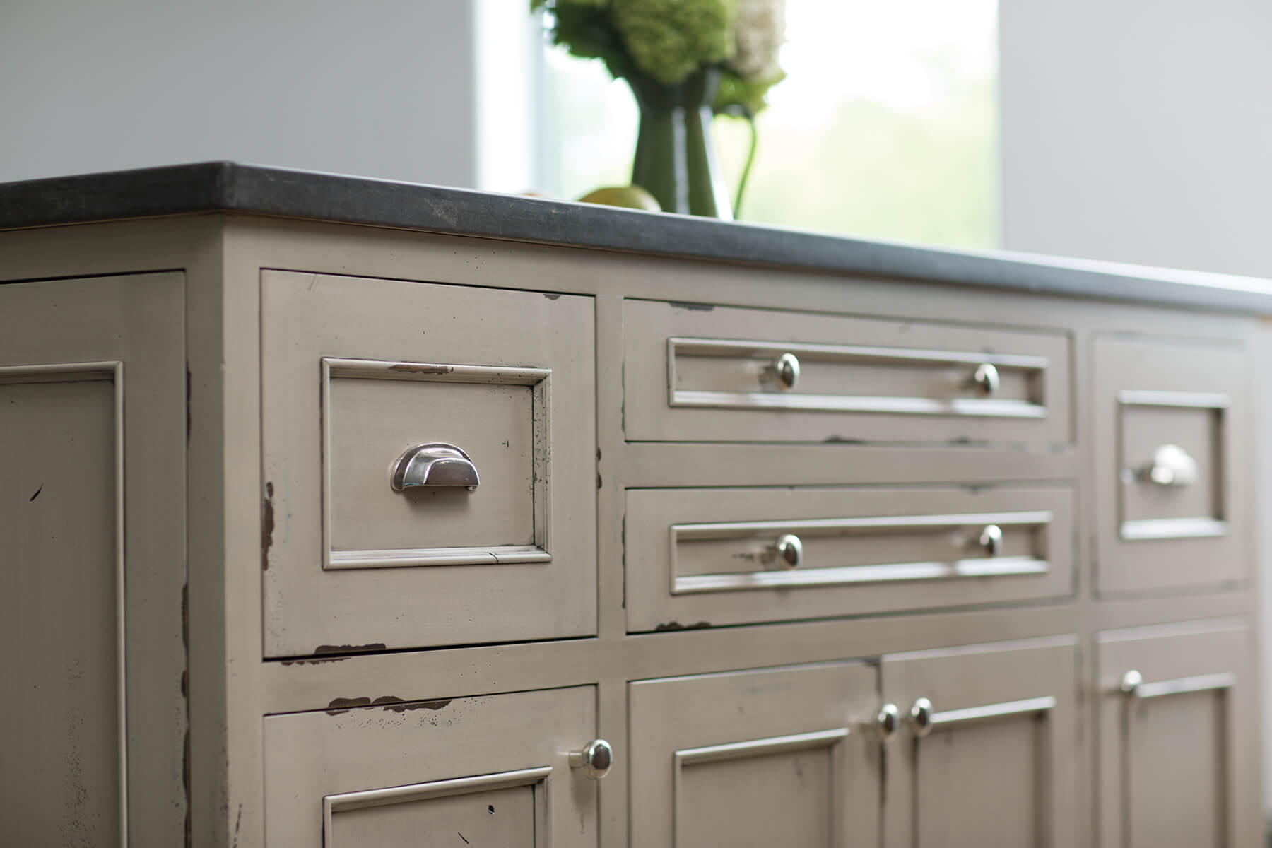A kitchen island with a beautiful distressed paint finish with Dura Supreme's Heritage Paint finish.