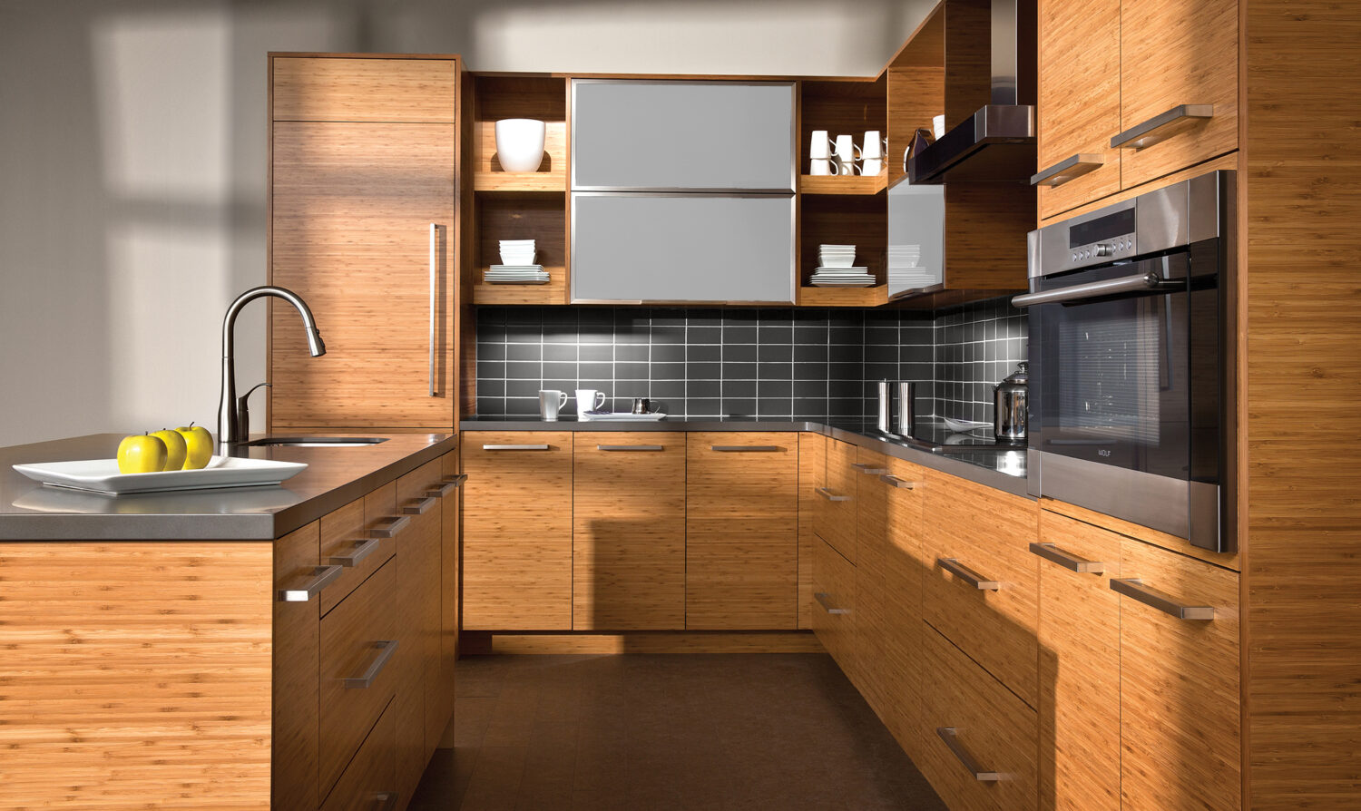 A contemporary style kitchen with warm bamboo cabinets from Dura Supreme Cabinetry.