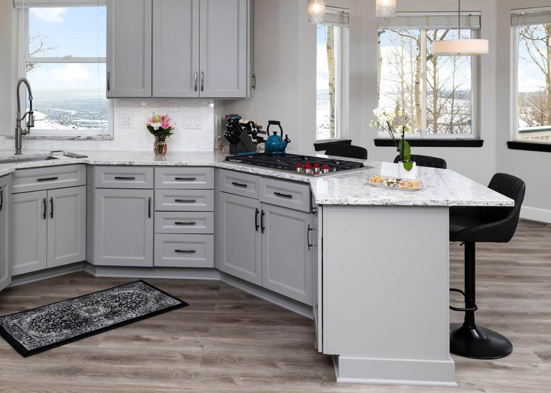 An angled peninsula that increases the size of the kitchen and adds more storage and functionality.