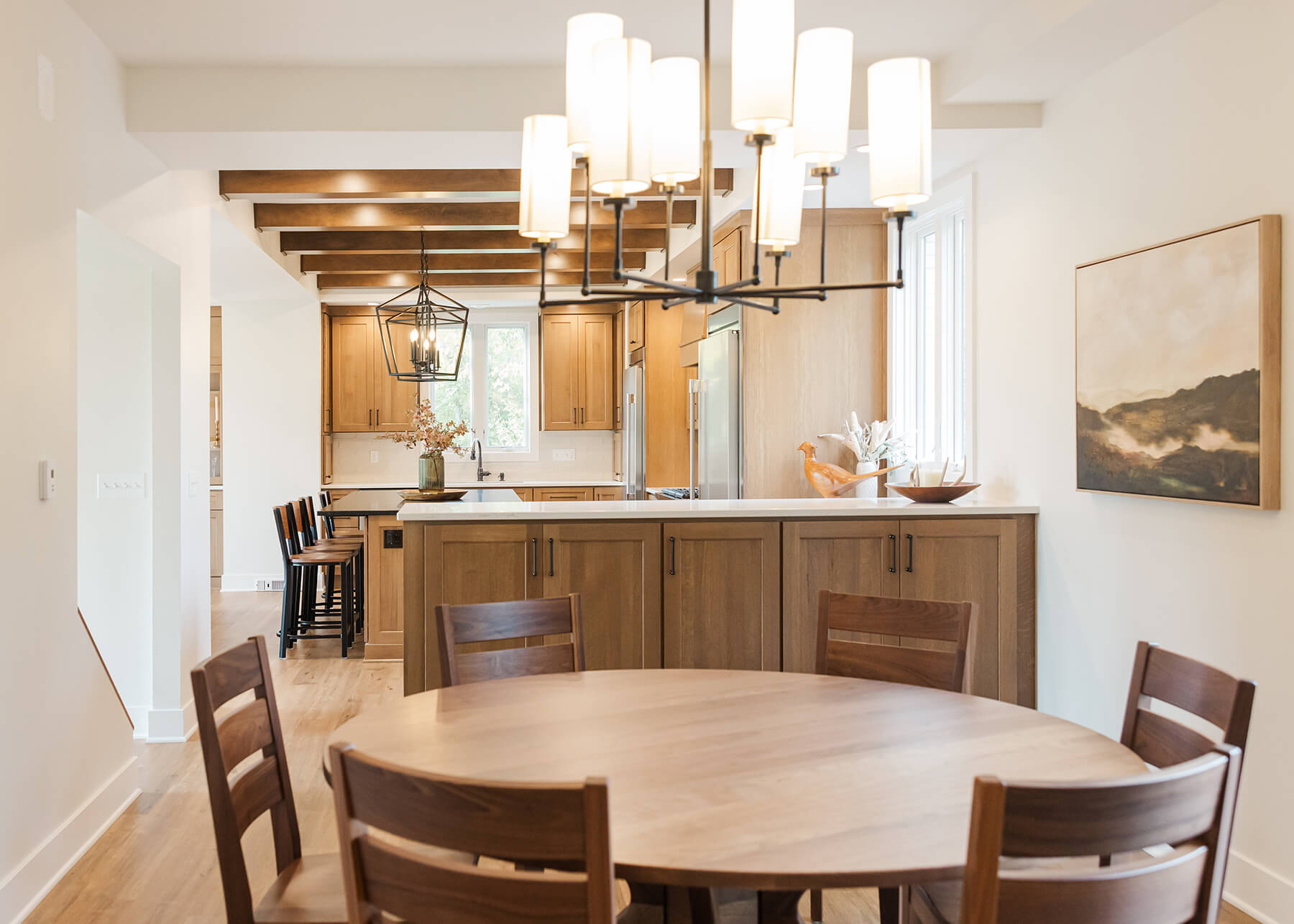 A kitchen peninsula that defines the dining room space from the kitchen in an open concept home.