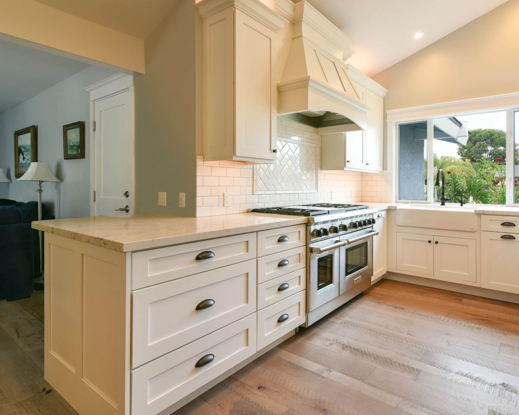 This peninsula island kitchen has a micro peninsula that sticks out enough to extend the floor plan of the kitchen just a few more feet.