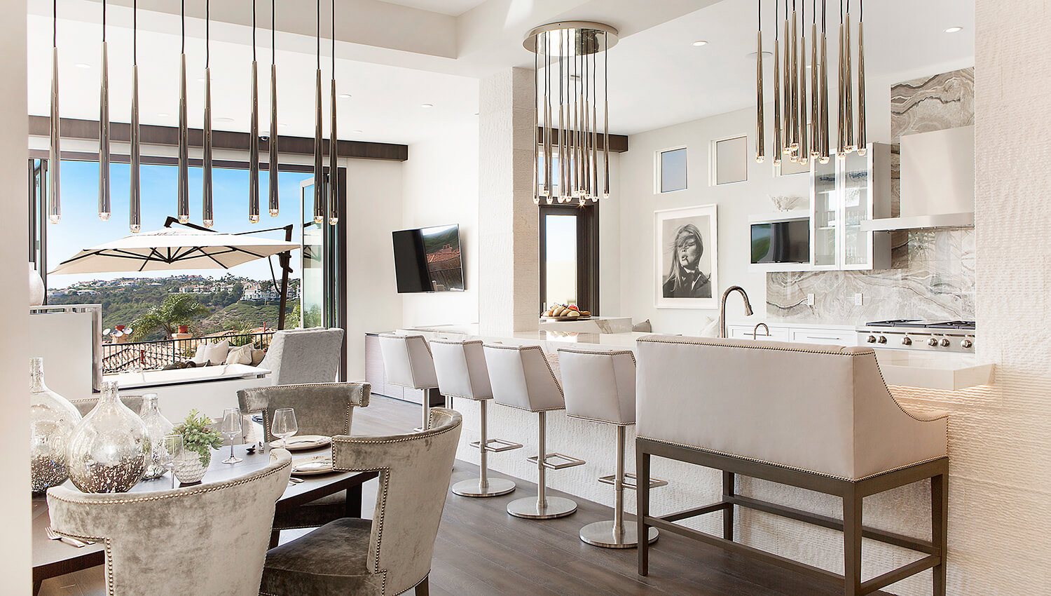 A long kitchen island peninsula with lots of bar stool seating in a contemporary home design.