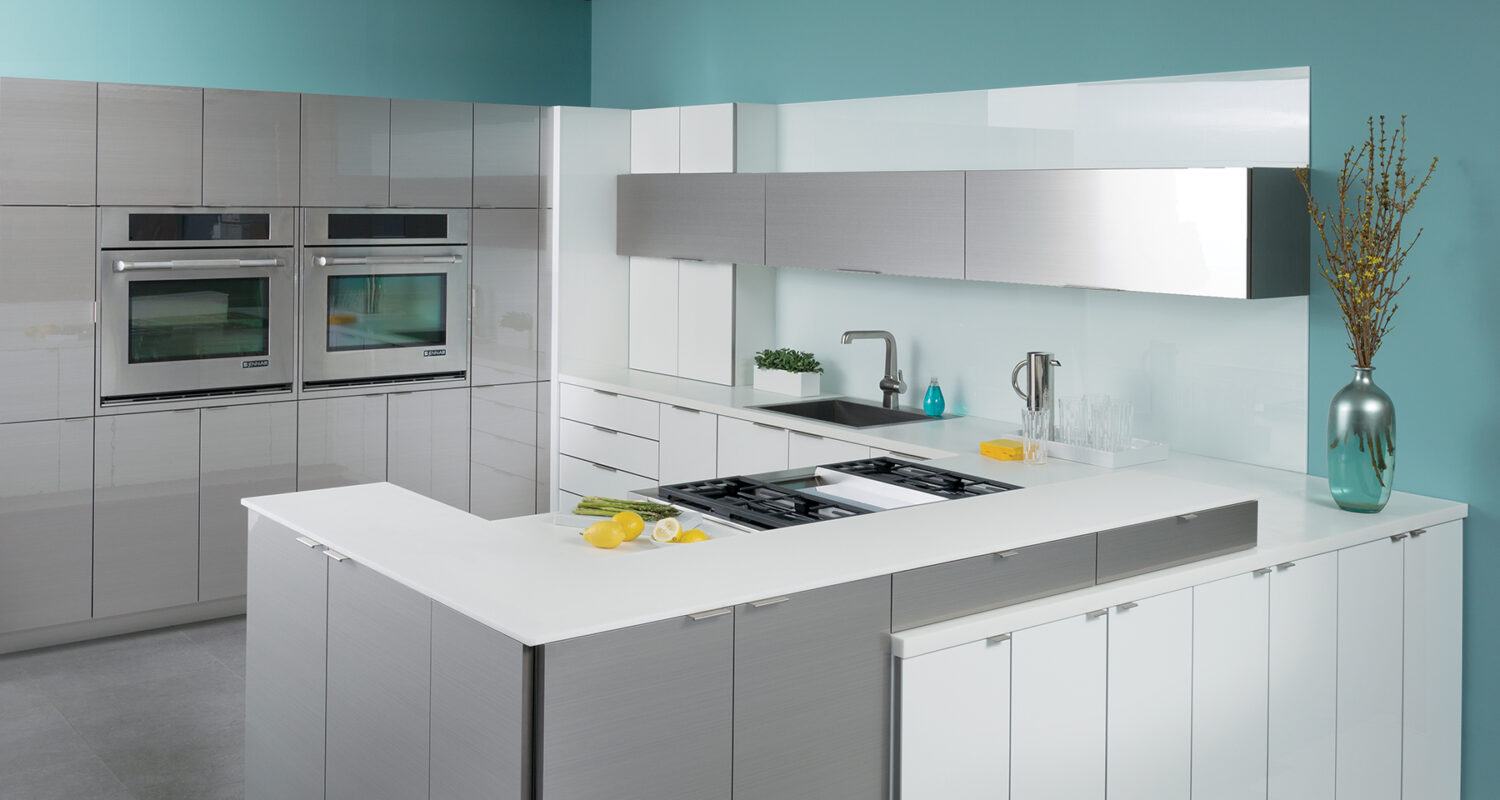 A modern kitchen design with glossy and contemporary cabinets the look similar to stainless steel and white high gloss acrylic cabinets.