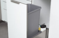 Stainless Steel metal Pul-out Cabinet for a Waste Basket. Kitchen Cabinets and storage from Dura Supreme Cabinetry.