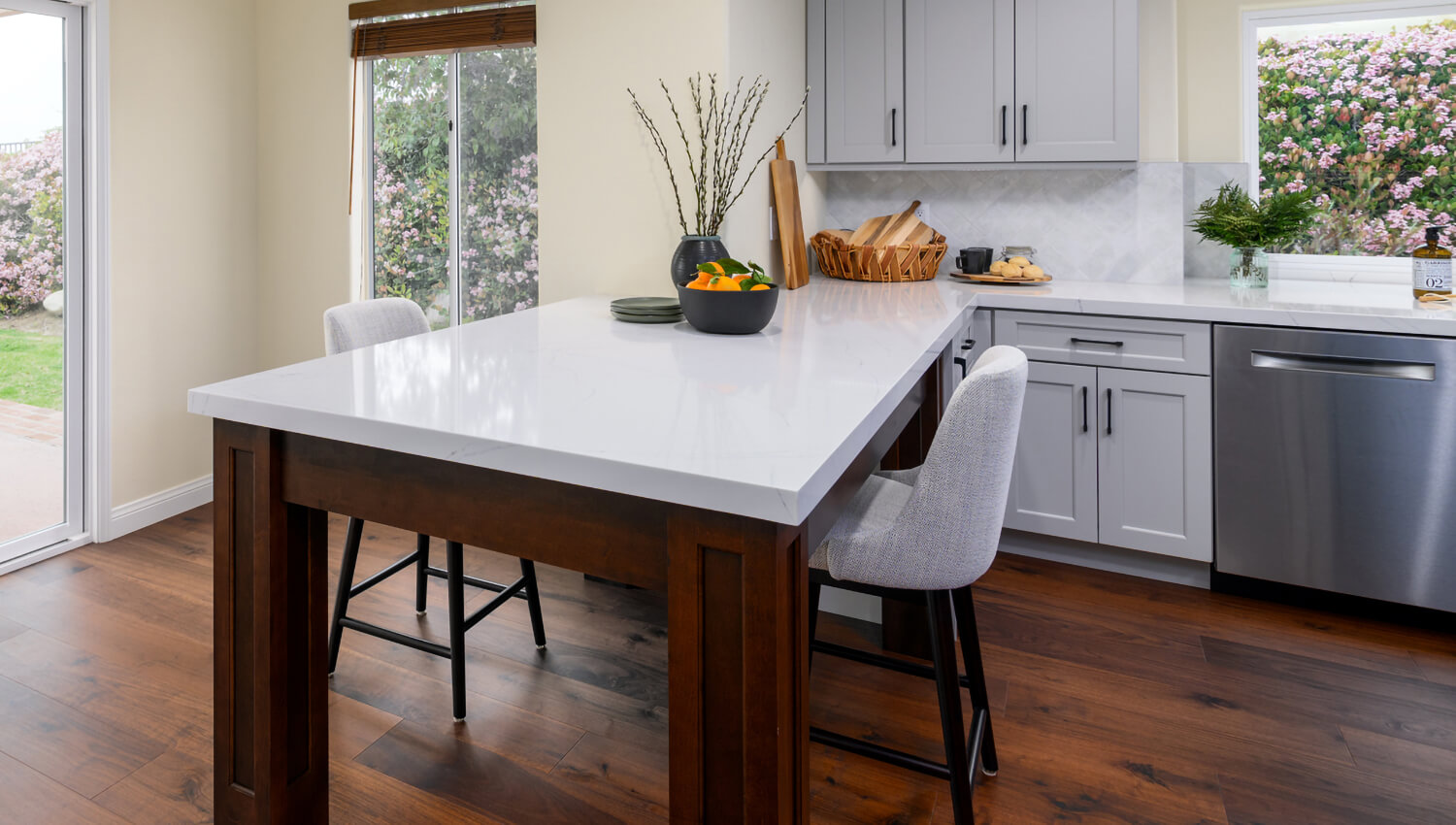 This kitchen peninsula is designed to look like a kitchen table.