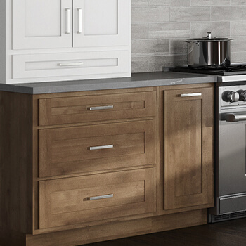 A newly remodeled kitchen desing with standard overlay kitchen cabinets in a warm stained wood finish. Traditional American “framed construction” cabinetry is custom-crafted with premium joinery and materials and a panoramic palette of door styles and finishes.