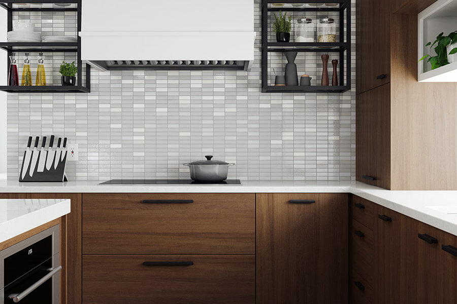 This modern walnut kitchen design has a sleek white painted wood hood, metal floating shleves flaning around the hood, and a tall counter sitting cabinet for supplies. The deep drawers below the cooktop offer lots of kitchen storage for pots & pans while the cabinet to the side has storage space for cooking oils and spices.