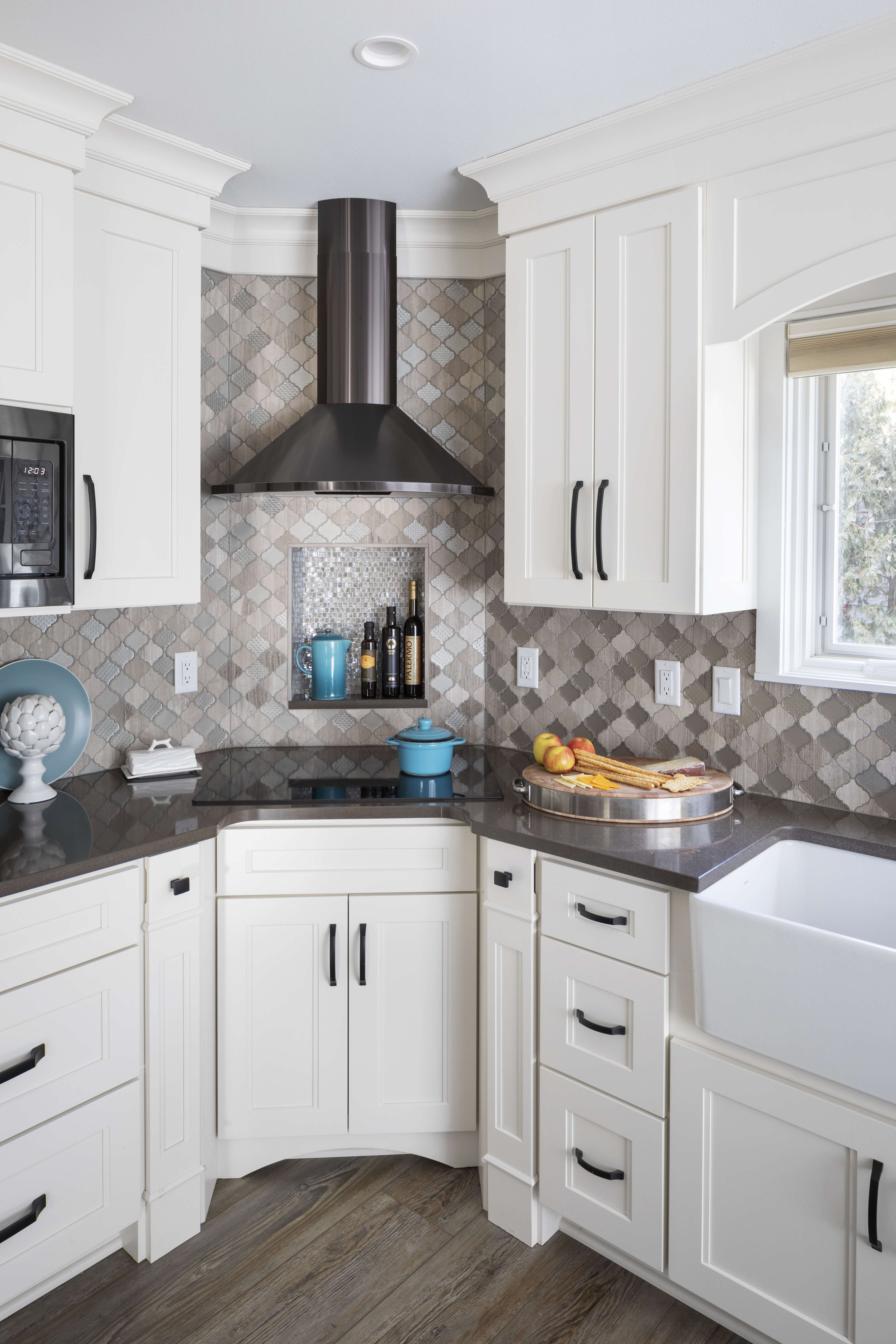 A kitchen remodel with a corner range that is tucked back.