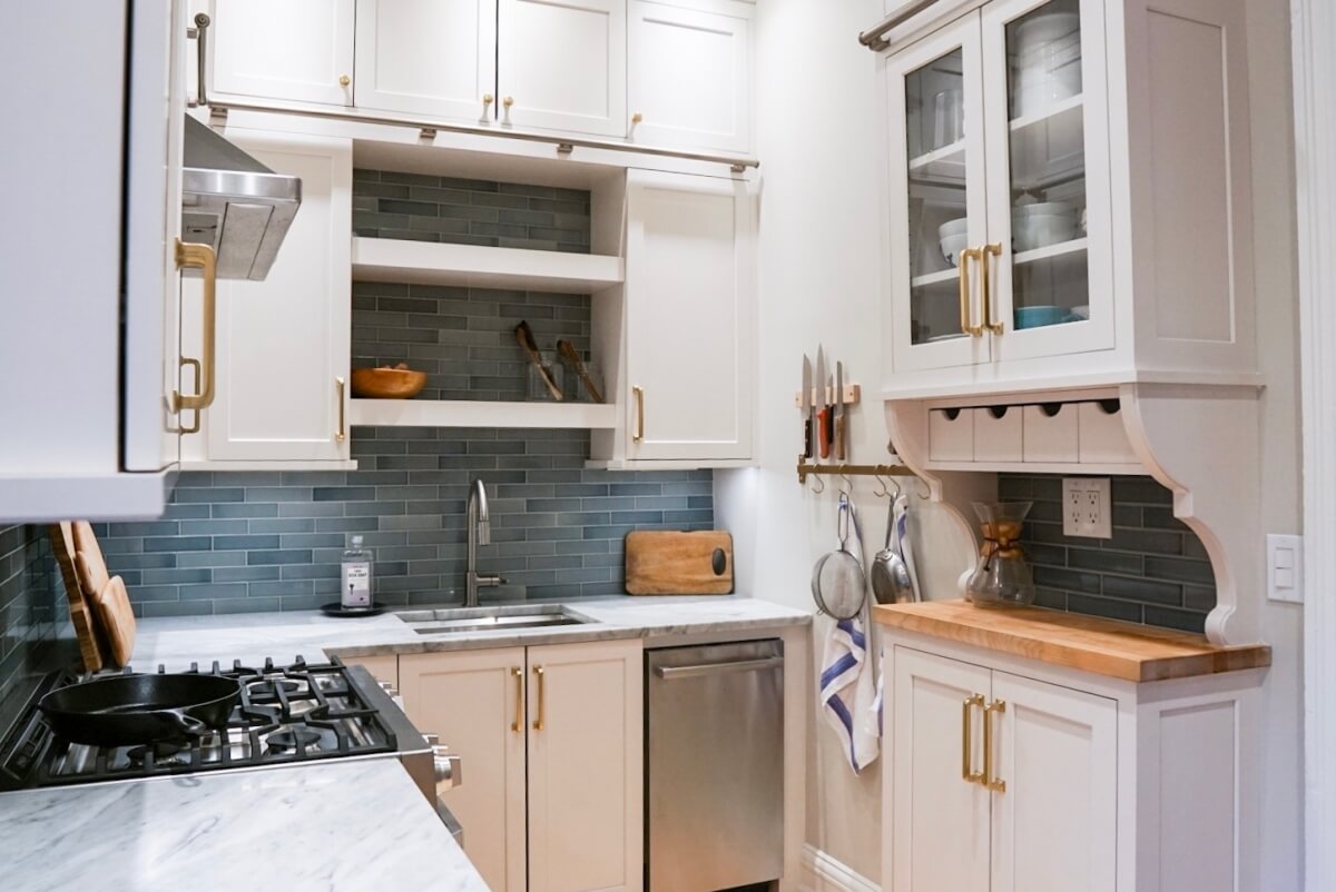 A shallow, hutch-like space catches your eye as you step into this kitchen. 