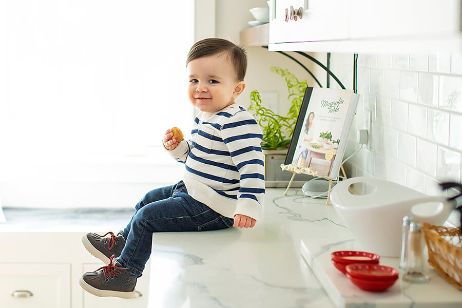 Learn how to remodel a kitchen smoothly. This little toddler boy is happy about his new kitchen from Dura Supreme Cabinetry. You’re going to be without your kitchen or bathroom for a while — rooms you and your family use and rely on multiple times each day — and getting by without those spaces can be a trying experience unless you’re prepared. Learn how to be prepaired and best practices during a kitchen remodel.