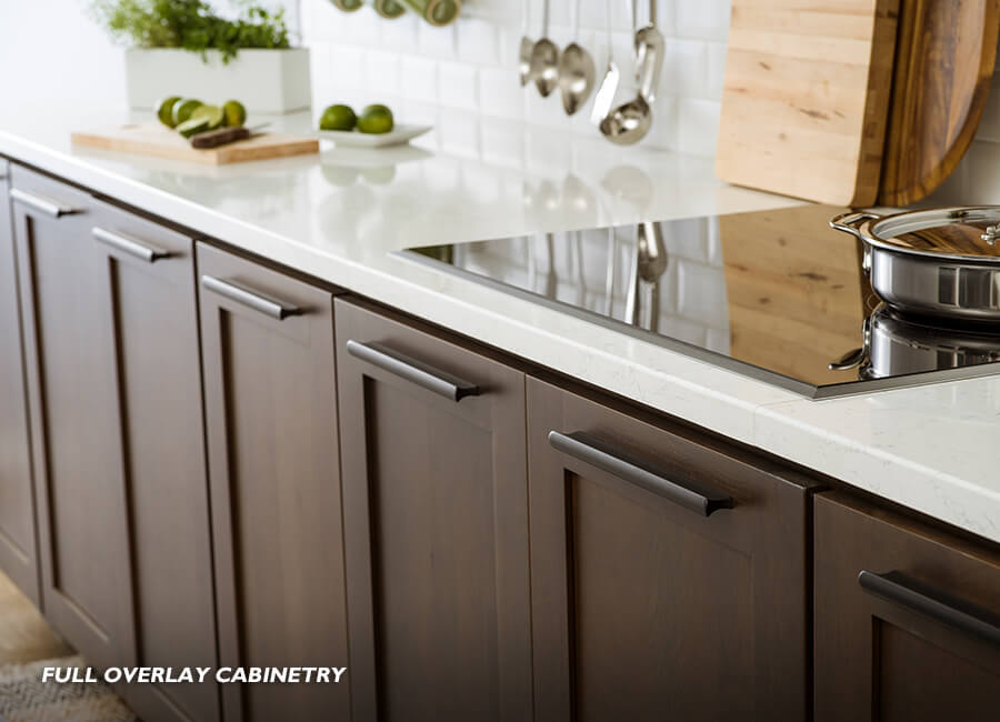 Full Overlay kitchen cabinetry. This is a cabinetry door construction style where the cabinet doors and drawer fronts are sized to cover most of the cabinet face frame, leaving minimal space (reveal) between adjacent doors. This option creates a more custom look and is one of our most popular styles.