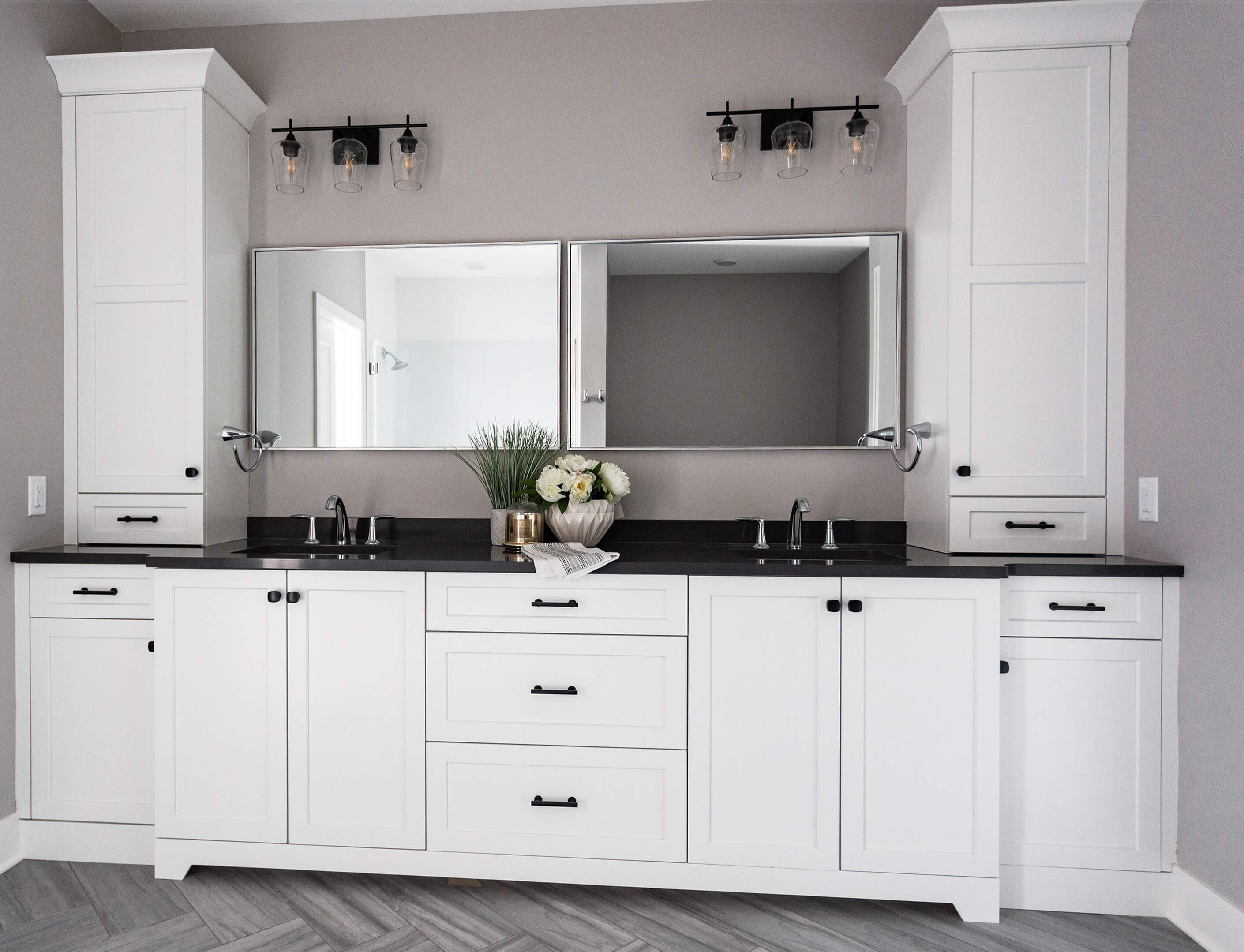 A beautiful white transitional styled bathroom with two towers on the outer sides.