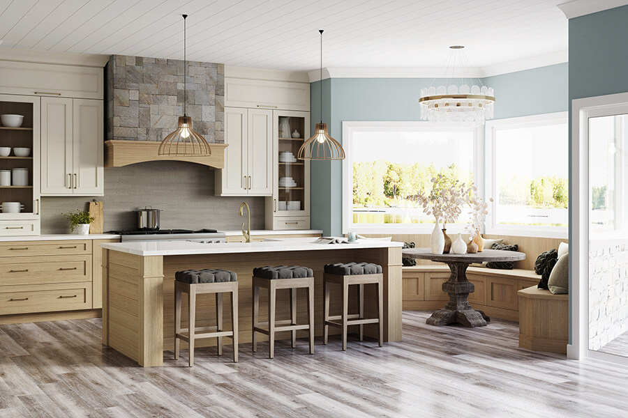 This dreamy lake house kitchen captures the home’s lake shore lifestyle with watery blue walls, shiplap ceilings, nature-inspired wood and white painted cabinetry, and natural stone accents. The kitchen design uses a natural off-white paint color contrasted by a light white washed stain on Quarter Sawn White Oak cabinets.