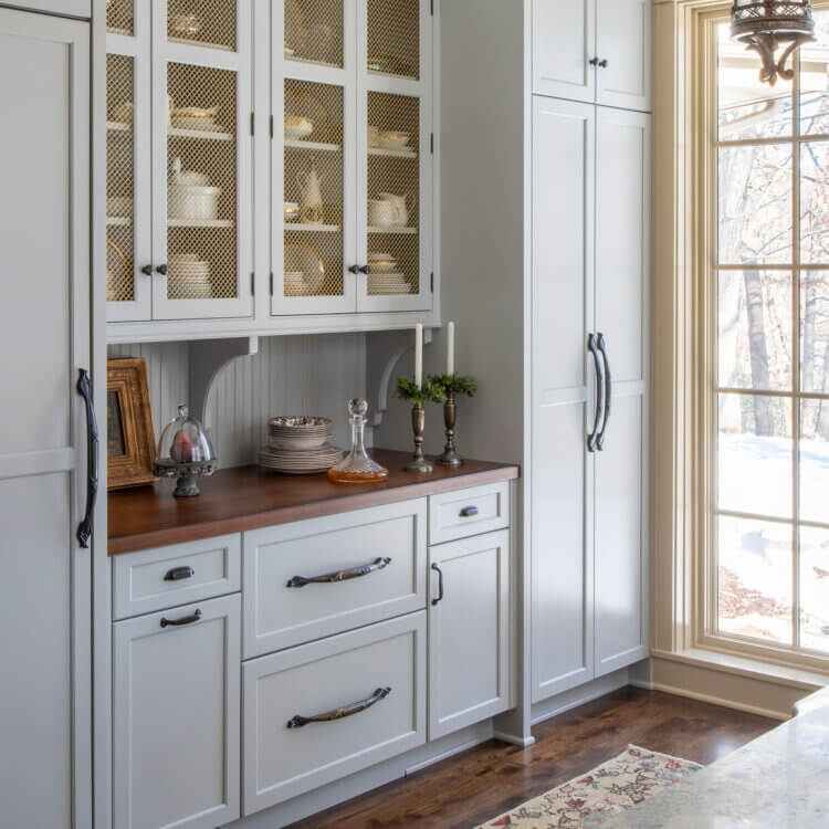 A remodel story about a built-on addition that extends the original kitchen to include an old english style butler's pantry.