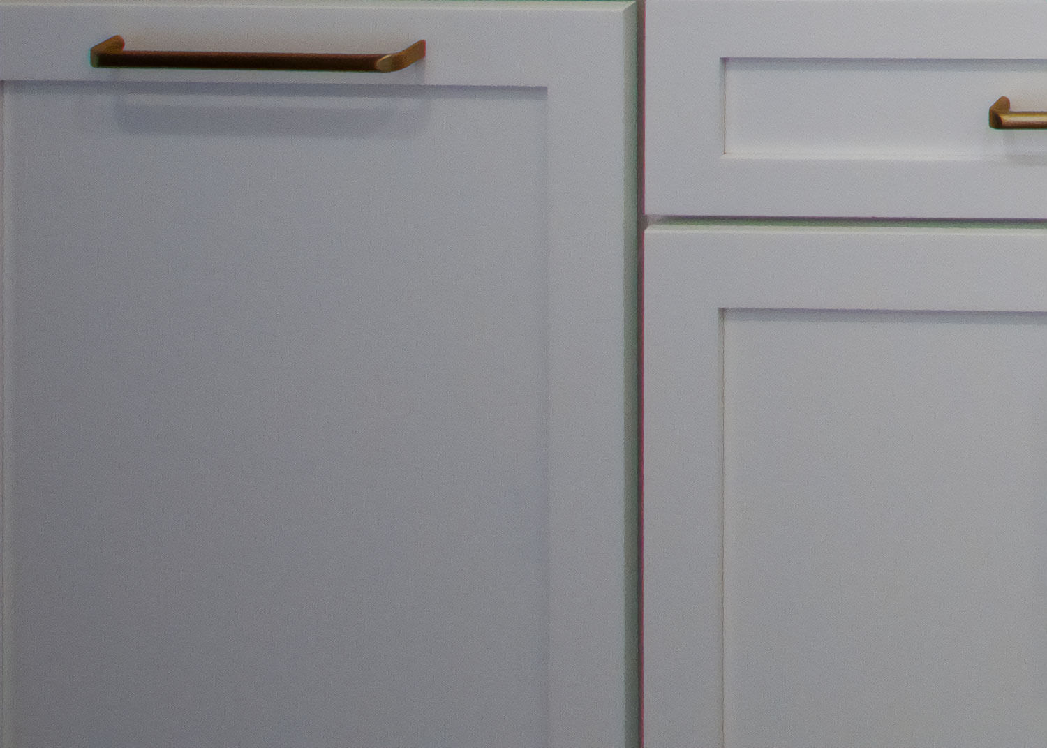 A close up of the images shows its hard to see if the cabinets are actually white or gray.