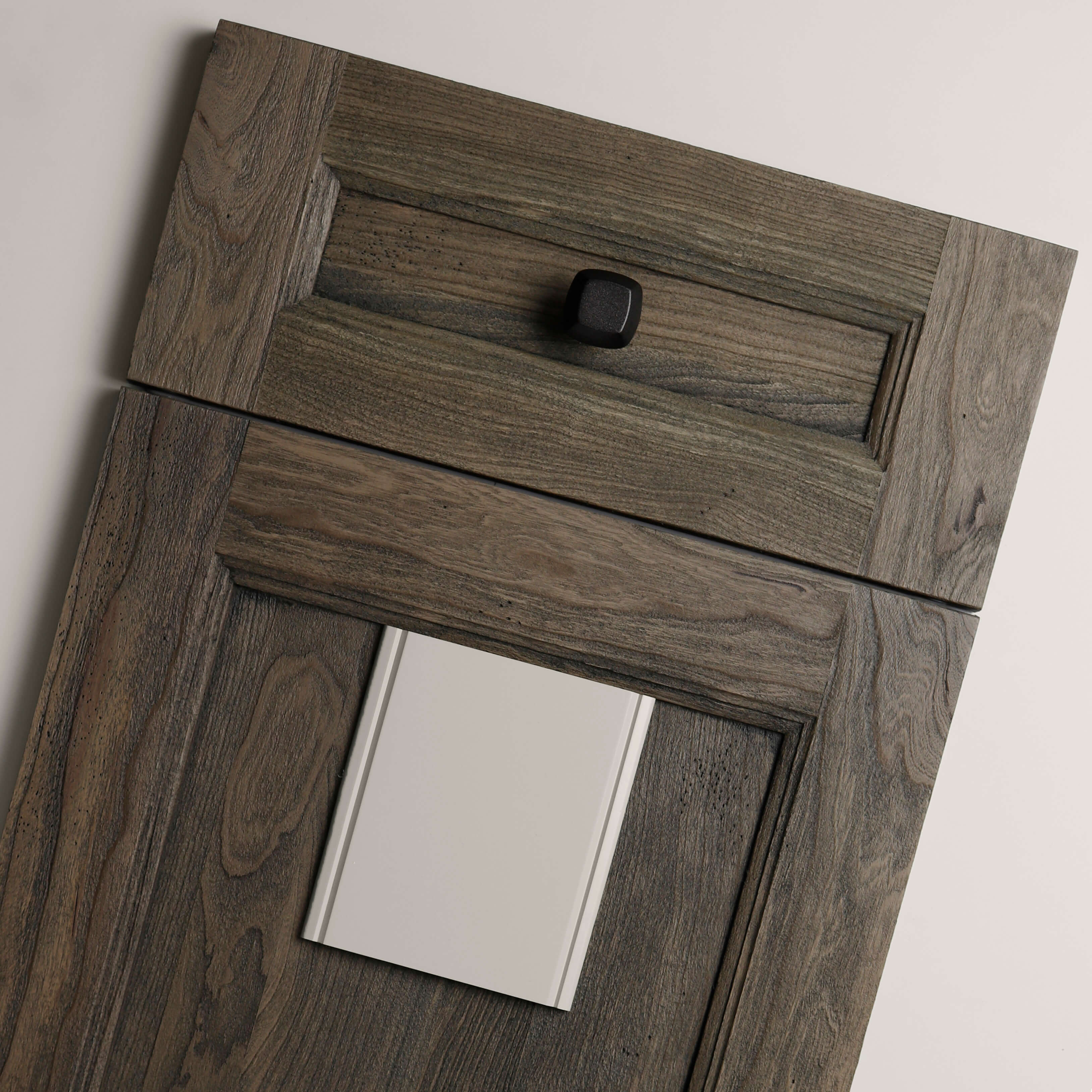 A beautiful flat lay mood board showing a rustic, weathered flat panel door with classic details paired with a muted white paint sample called 