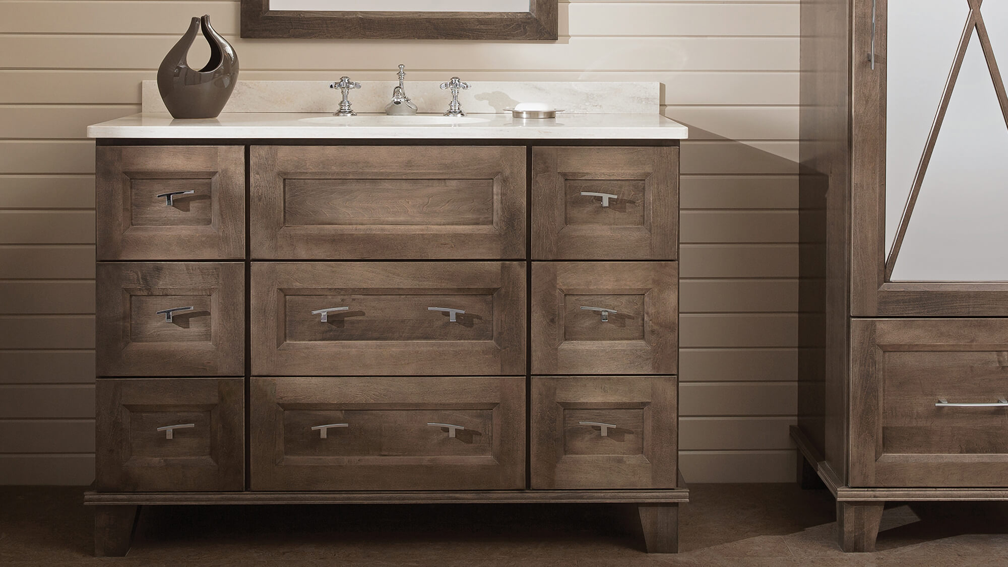 A furniture style bathroom vanity with custom options for bun feet, cabinet doors, configurations, finish, and style. Dura Supreme Cabinetry's Furniture Vanity Style #2.