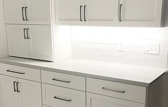 An all white kitchen with quality shaker style cabinets from Dura Supreme Cabinetry.