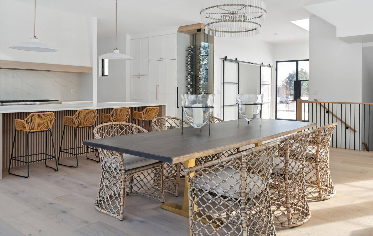 The dining room looking into the new construction modern farmhouse kitchen.