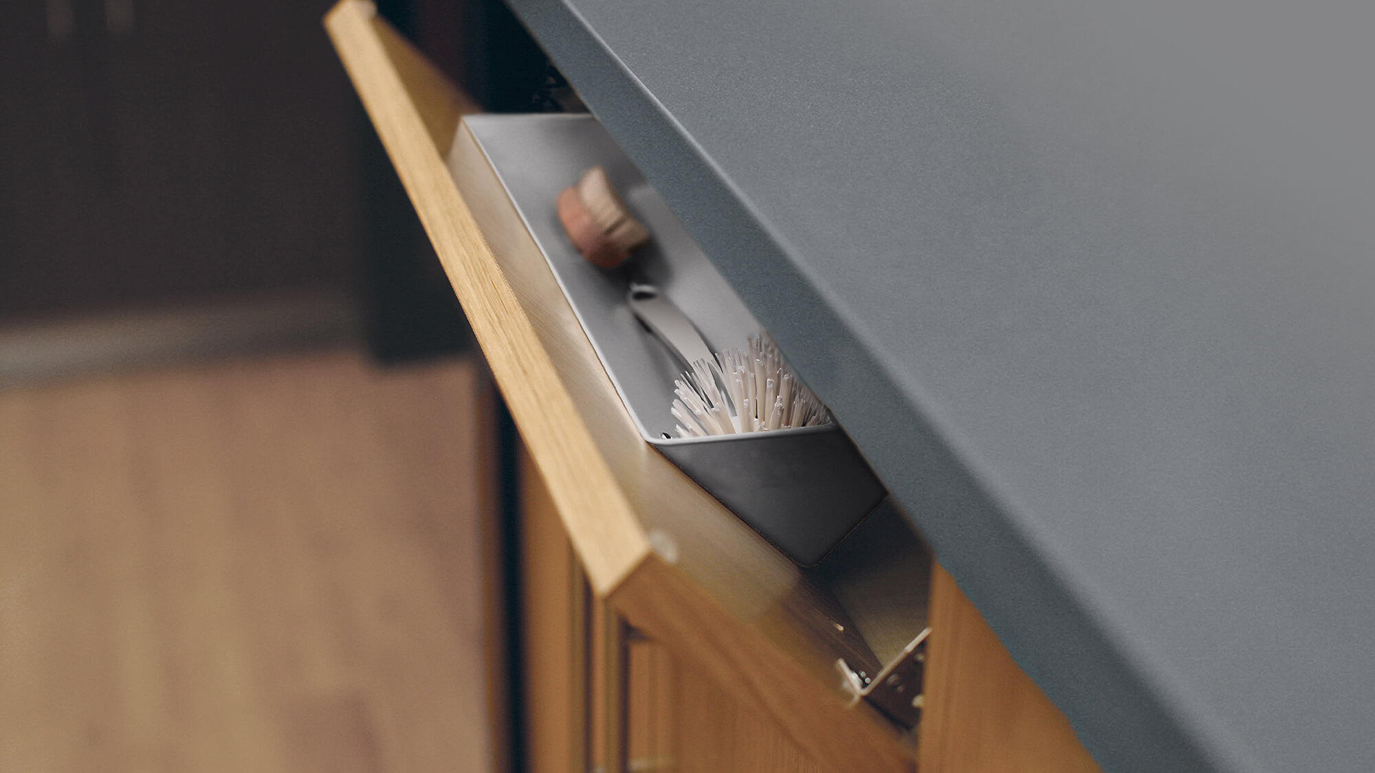 Neatly conceal all your scrub brushes and dish scrapers when they are not in use with this tip-down sink tray (TDFS) from Dura Supreme Cabinetry.