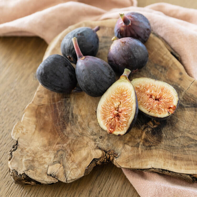 A close up of a tablescape with natural elements used as decor and interior design details.